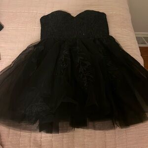 Home coming dress in black with a built in bra size 2